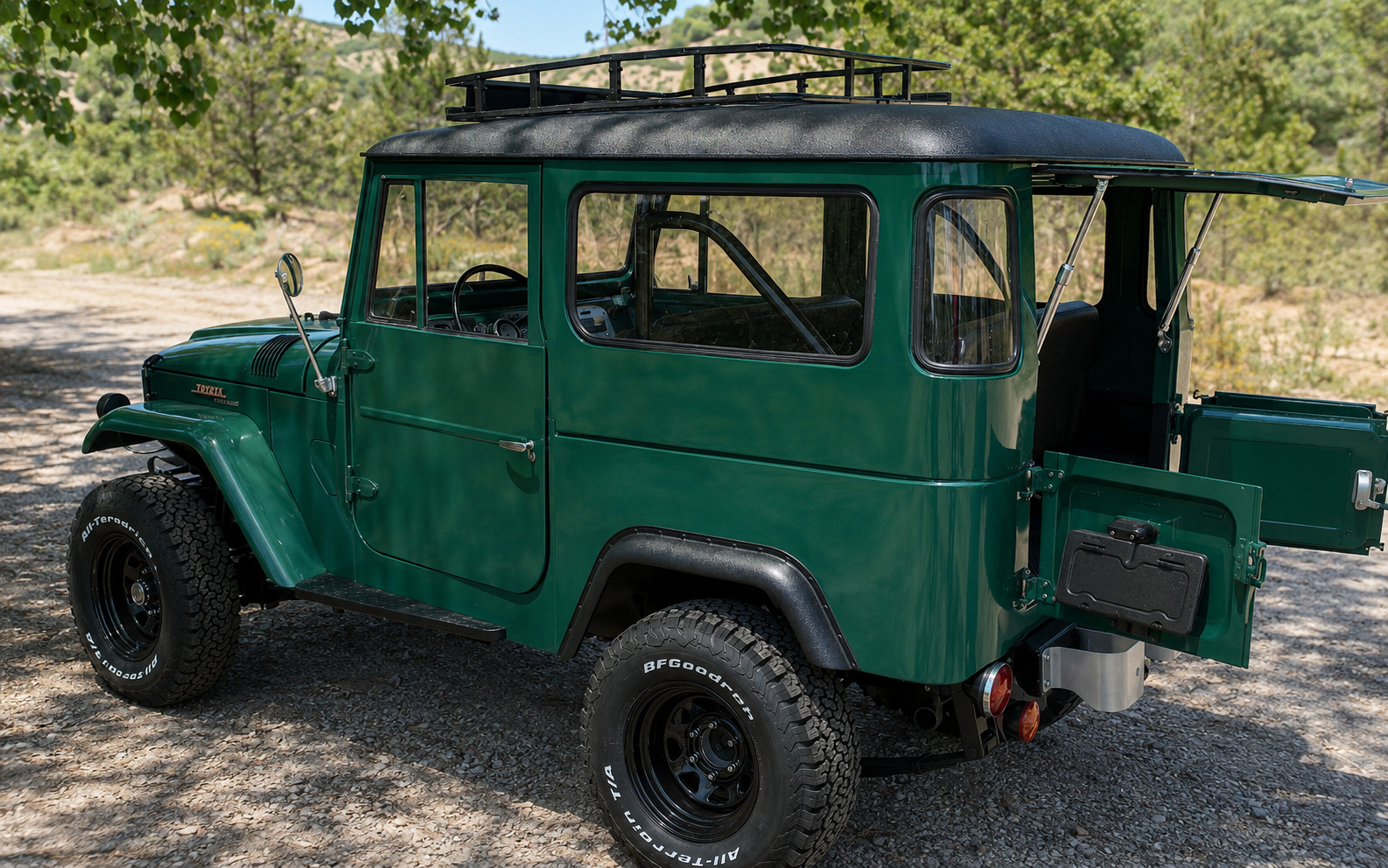 Green 1967 Toyota Land Cruiser FJ40, rear three-quarter view